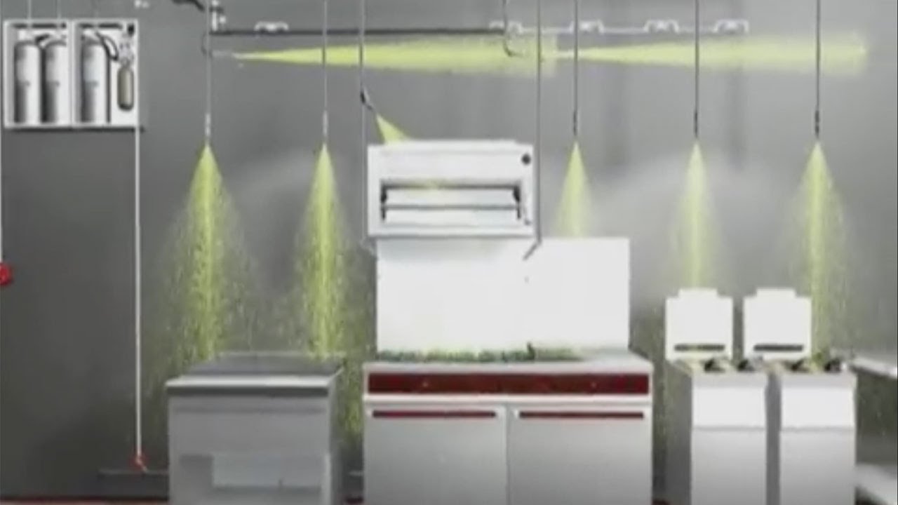 Illustration of a kitchen hood fire suppression system discharging agent over a commercial cooking line
