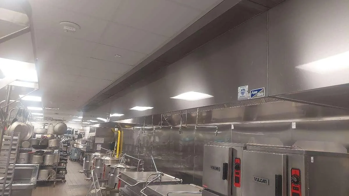 Boss Fire Protection sizing fire suppression nozzle coverage to a commercial cookline in Dallas-Fort Worth, TX