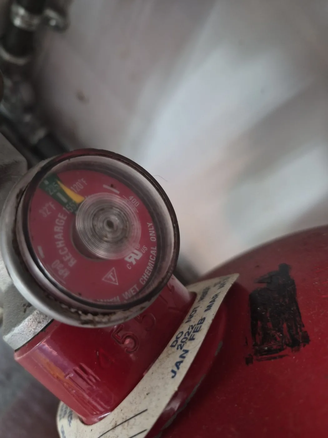 Boss Fire Protection pressure-testing and tagging a newly installed commercial kitchen fire suppression cylinder in Dallas-Fort Worth, TX
