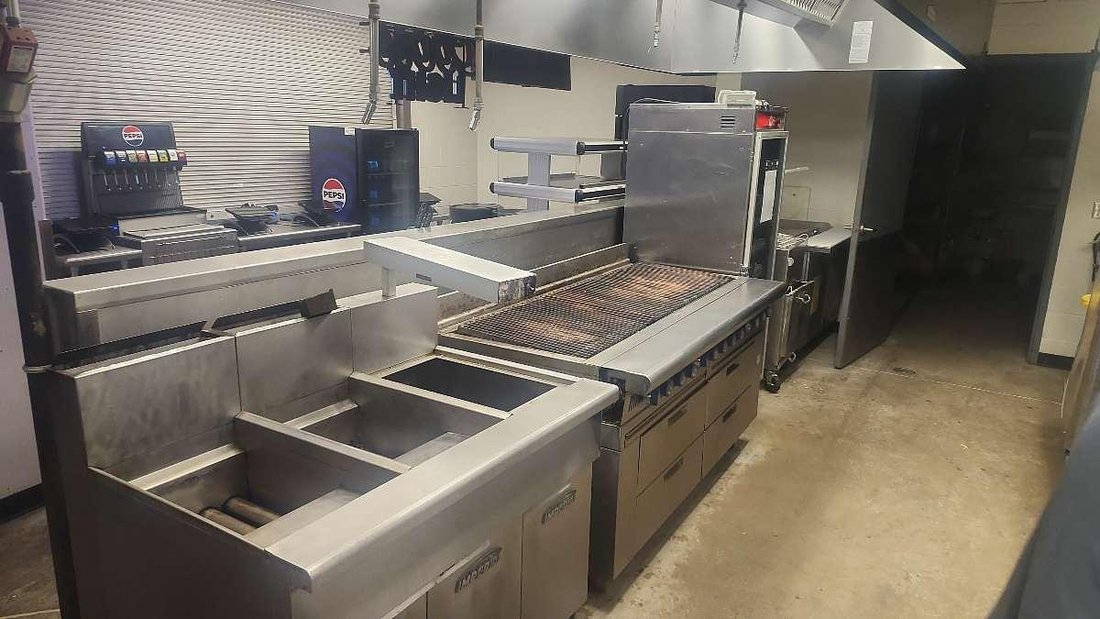 Boss Fire Protection fire suppression coverage over a stadium concession cookline with charbroiler and exhaust hood in Fort Worth