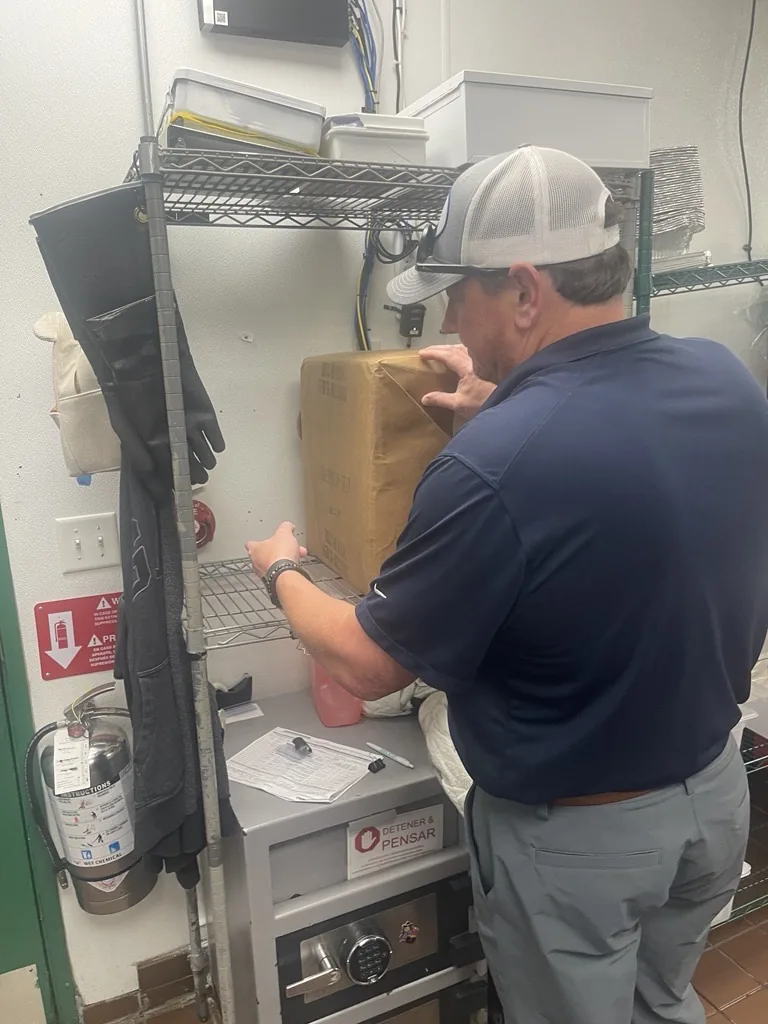 Boss Fire Protection technician running a diagnostic walk-through on a commercial fire suppression system in Dallas-Fort Worth, TX