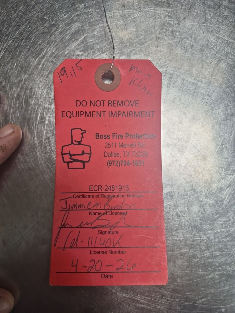 Boss Fire Protection red tag found on a non-compliant restaurant fire suppression system in a Dallas-Fort Worth commercial kitchen