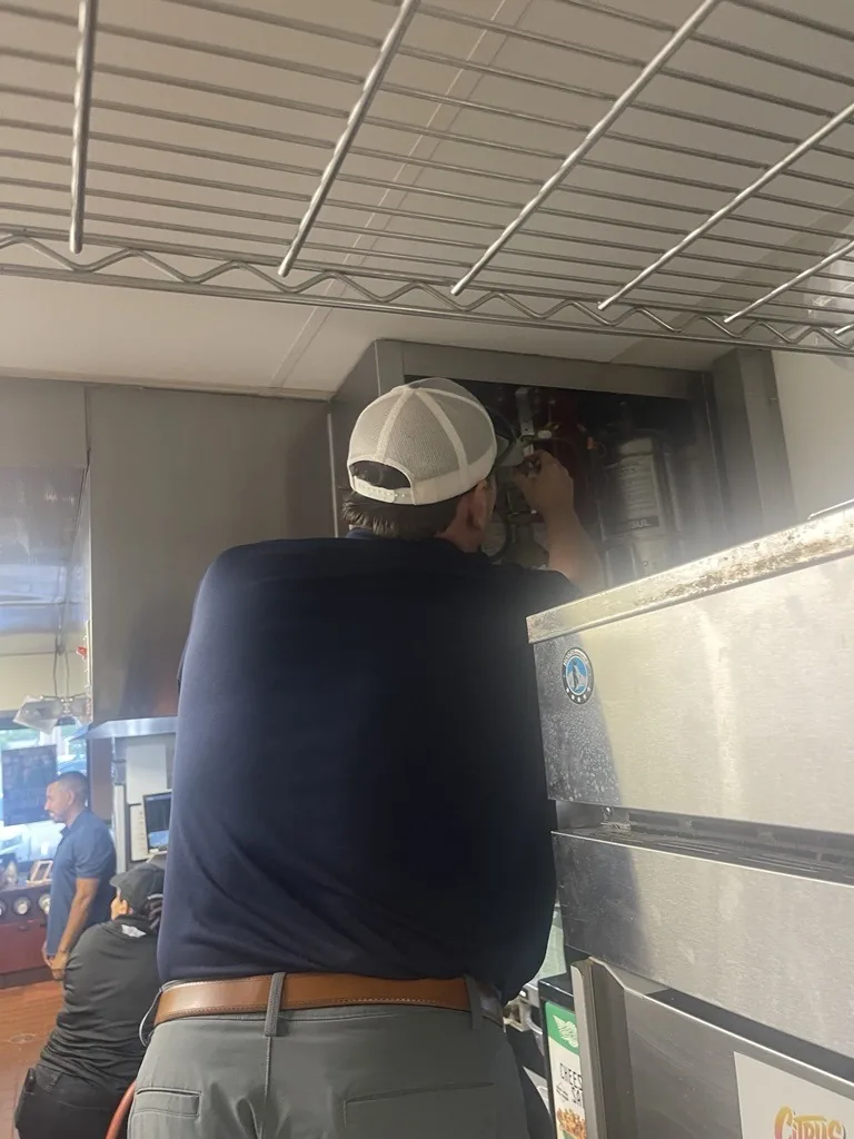An ANSUL R-102 fire suppression control head and cabinet serviced by Boss Fire Protection in Dallas-Fort Worth, TX